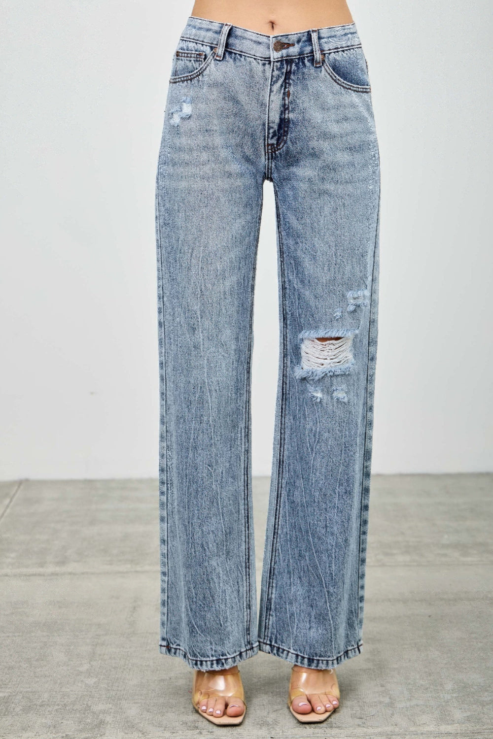 Toshe Women's Fashions mid-rise relaxed straight jeans with distressed hem, showcasing a casual denim look and stylish fit.