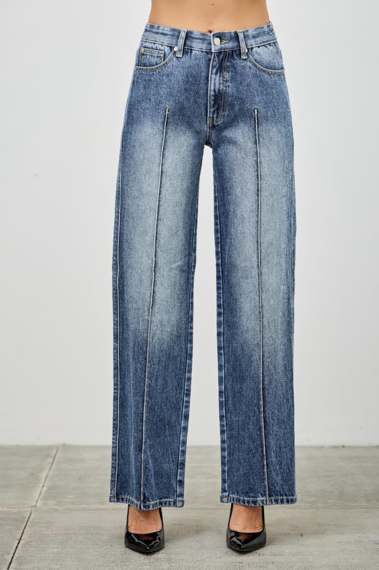 Mid-rise straight jeans with pintuck detailing from Toshe Women's Fashions, shown in a close-up view.