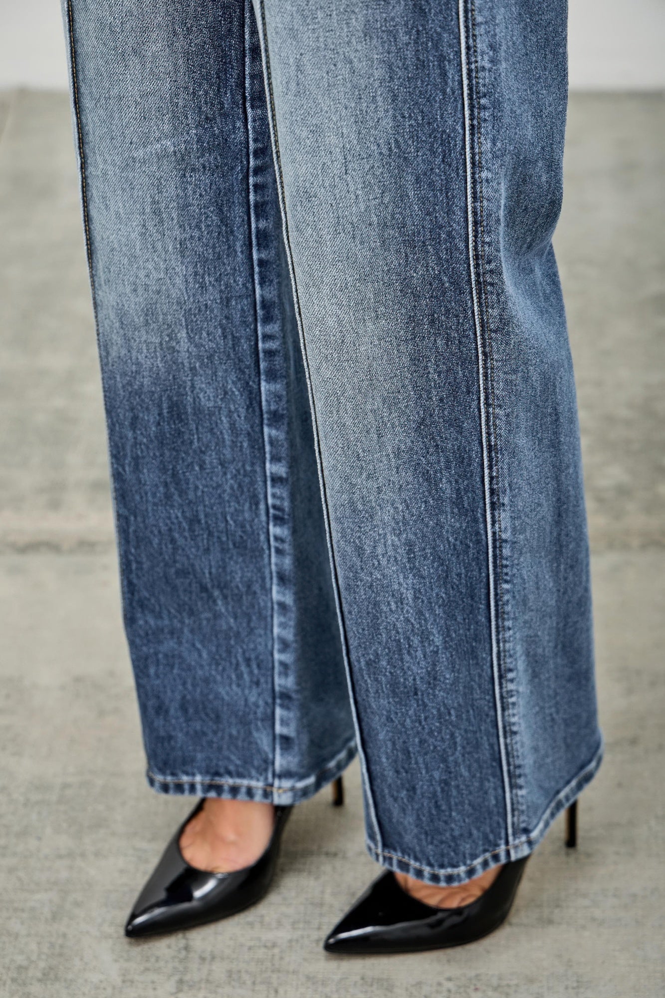 Toshe Women's Fashions mid-rise straight jeans with pintuck details, shown in a natural pose on a model.