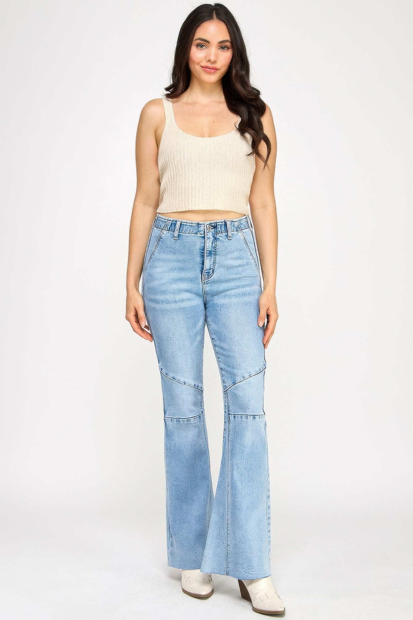 High rise flare jeans with seam detail from Toshe Women's Fashions, showcasing the fit and stylish stitching.