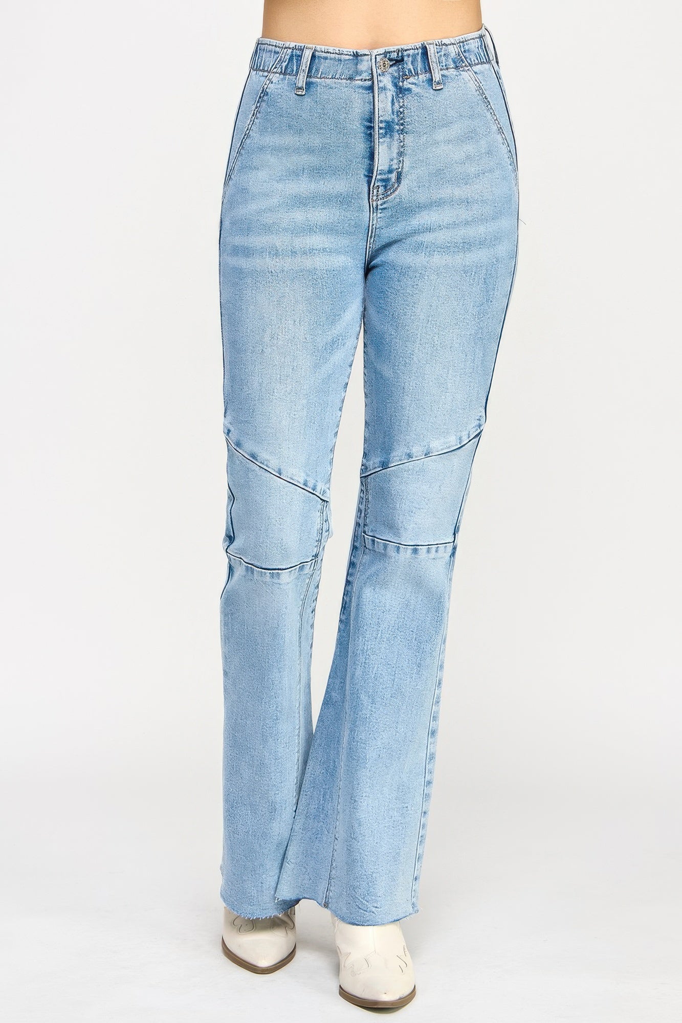 Toshe Women's Fashions high rise flare jeans with seam detail, showing the waist, flared legs, and stylish stitching in natural fabric.