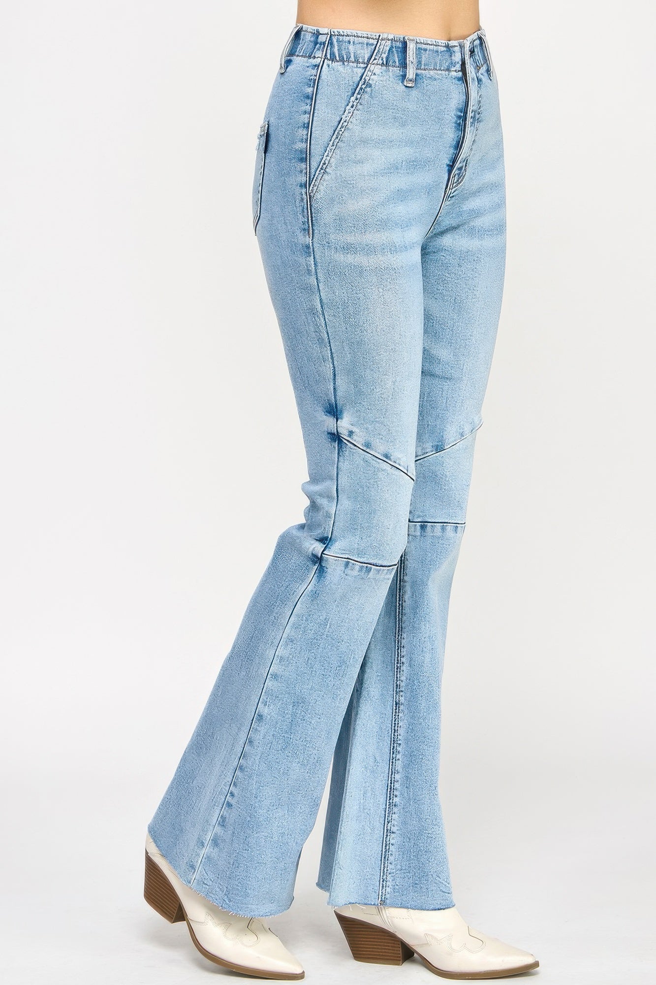High rise flare jeans with seam detail from Toshe Women's Fashions, showcasing the stylish back view.