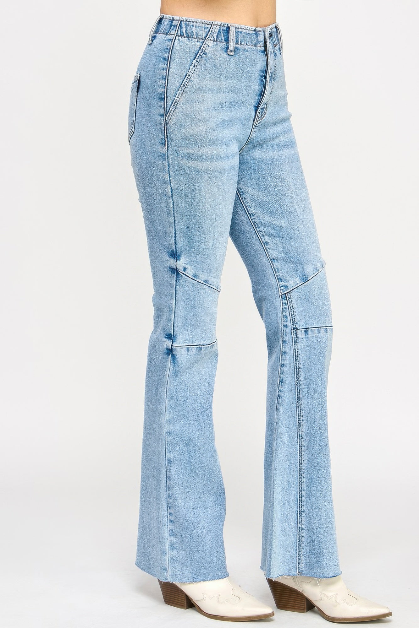 High rise flare jeans with seam detail from Toshe Women's Fashions, showcasing the fit and stylish design.