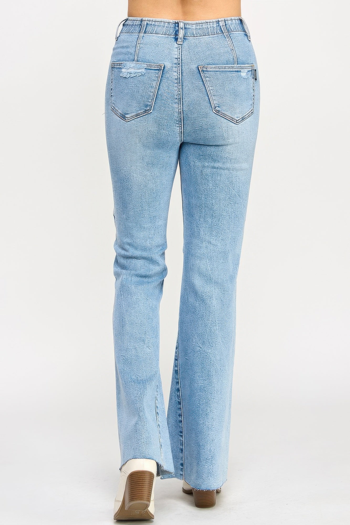 High rise flare jeans with seam detail from Toshe Women's Fashions, displayed on a mannequin.