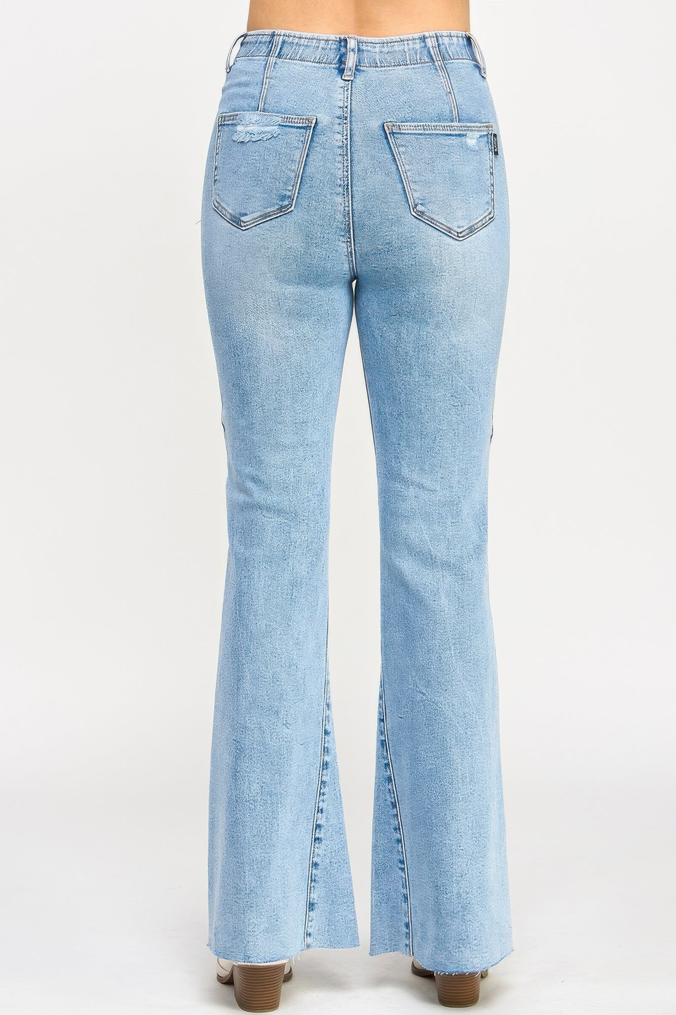 Toshe Women's Fashions high rise flare jeans with seam detail, showcasing a stylish fit and classic denim design.
