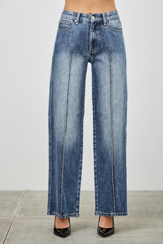 Mid-rise straight jeans with pintuck details from Toshe Women's Fashions, shown hanging on a wooden rack.