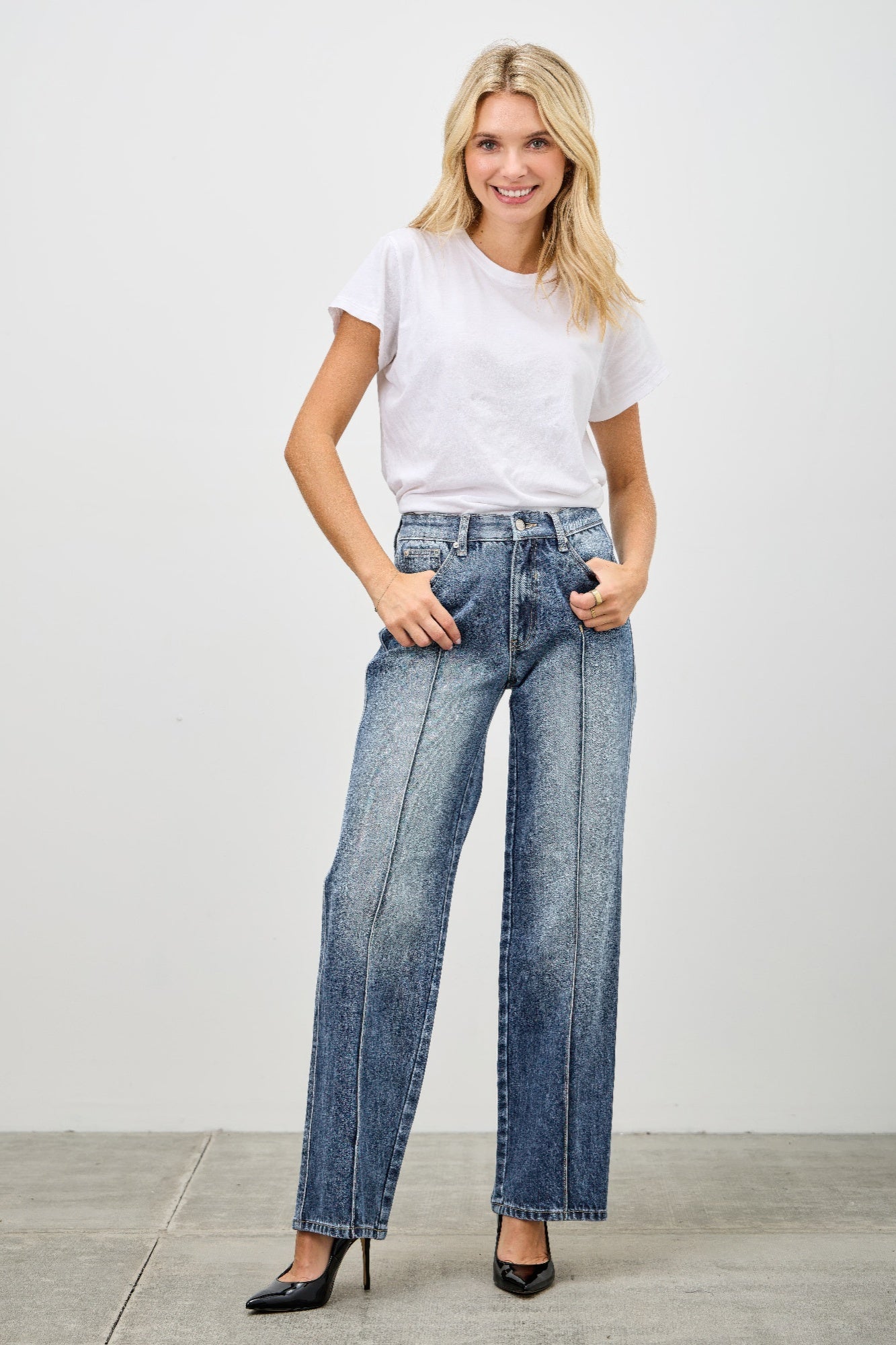 Toshe Women's Fashions mid-rise straight jeans with pintuck detailing, shown in a light wash denim.