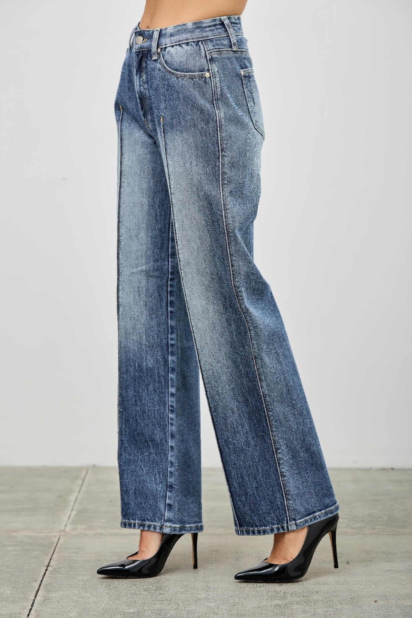 Toshe Women's Fashions mid-rise straight jeans with pintuck details, shown in a front view on a model.