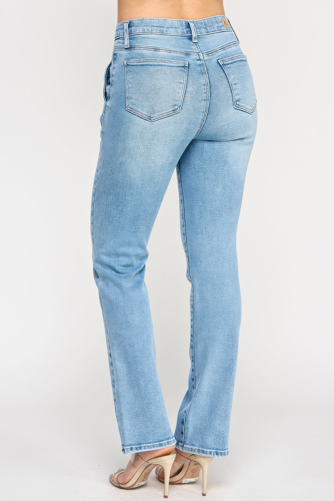 Toshe Women's Fashions high rise straight jeans with button pockets, showcasing fitted denim style and classic design.
