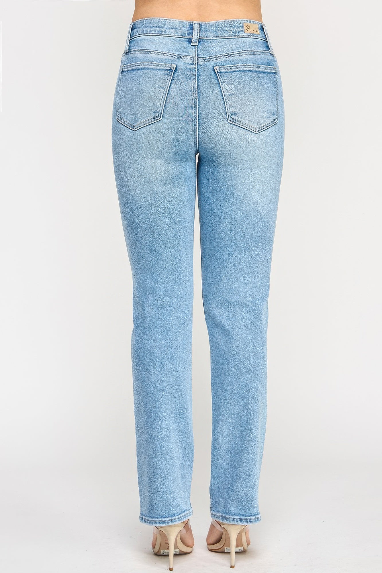 Toshe Women's Fashions high rise straight jeans with button pockets, shown hanging on a rack with a casual fit.