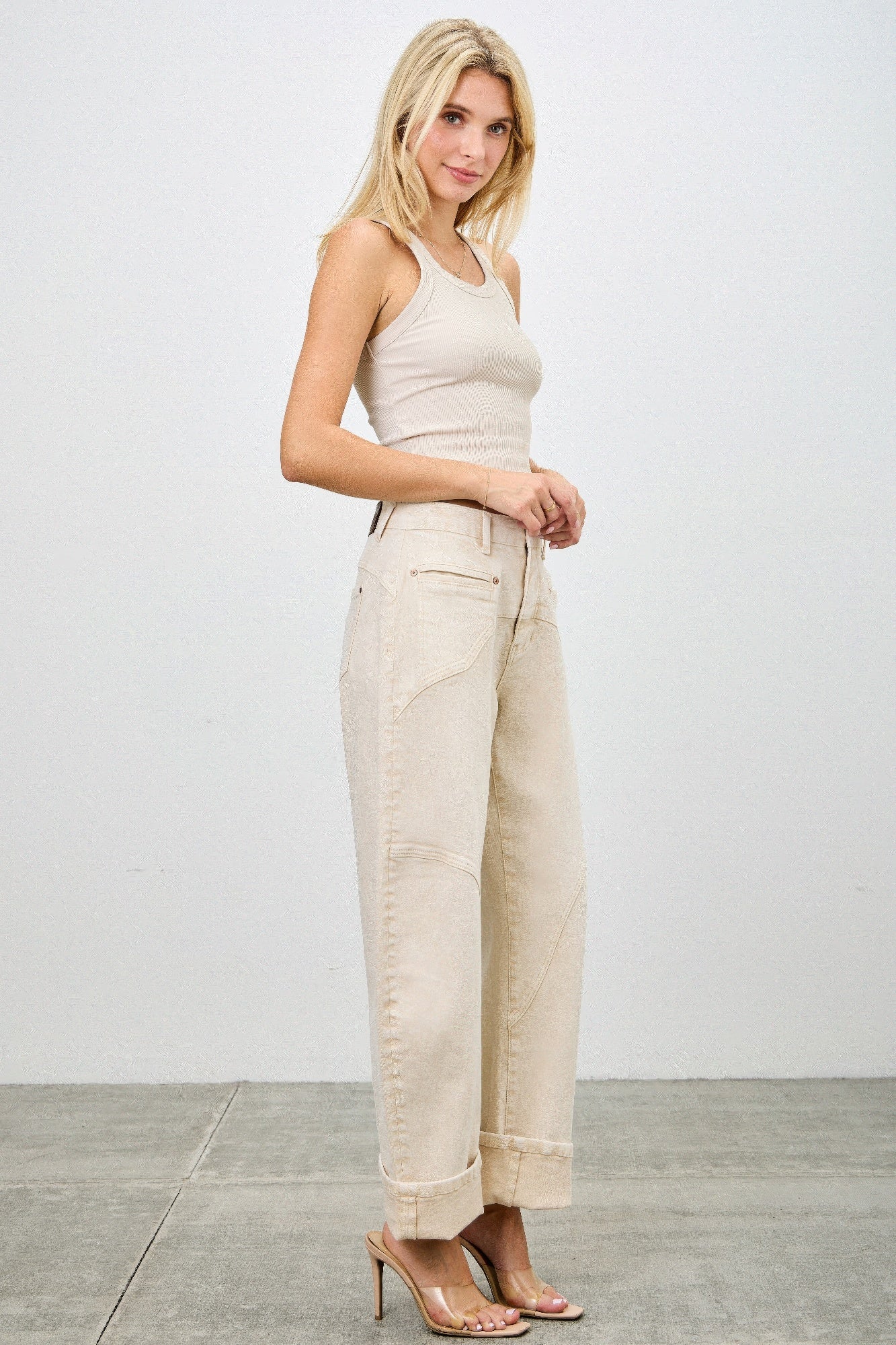 High rise colored Western barrel jeans by Toshe Women's Fashions, showing fit and vibrant fabric details.