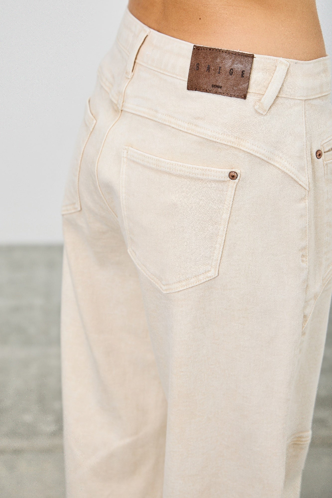 High rise colored Western barrel jeans by Toshe Women's Fashions, showing vibrant fabric and classic Western styling.