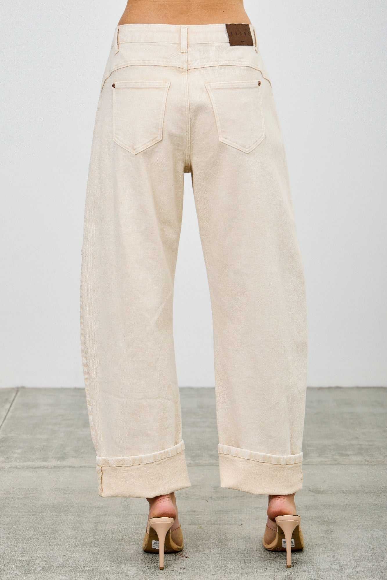 High rise colored Western barrel jeans by Toshe Women's Fashions with a stylish western design and vibrant color.