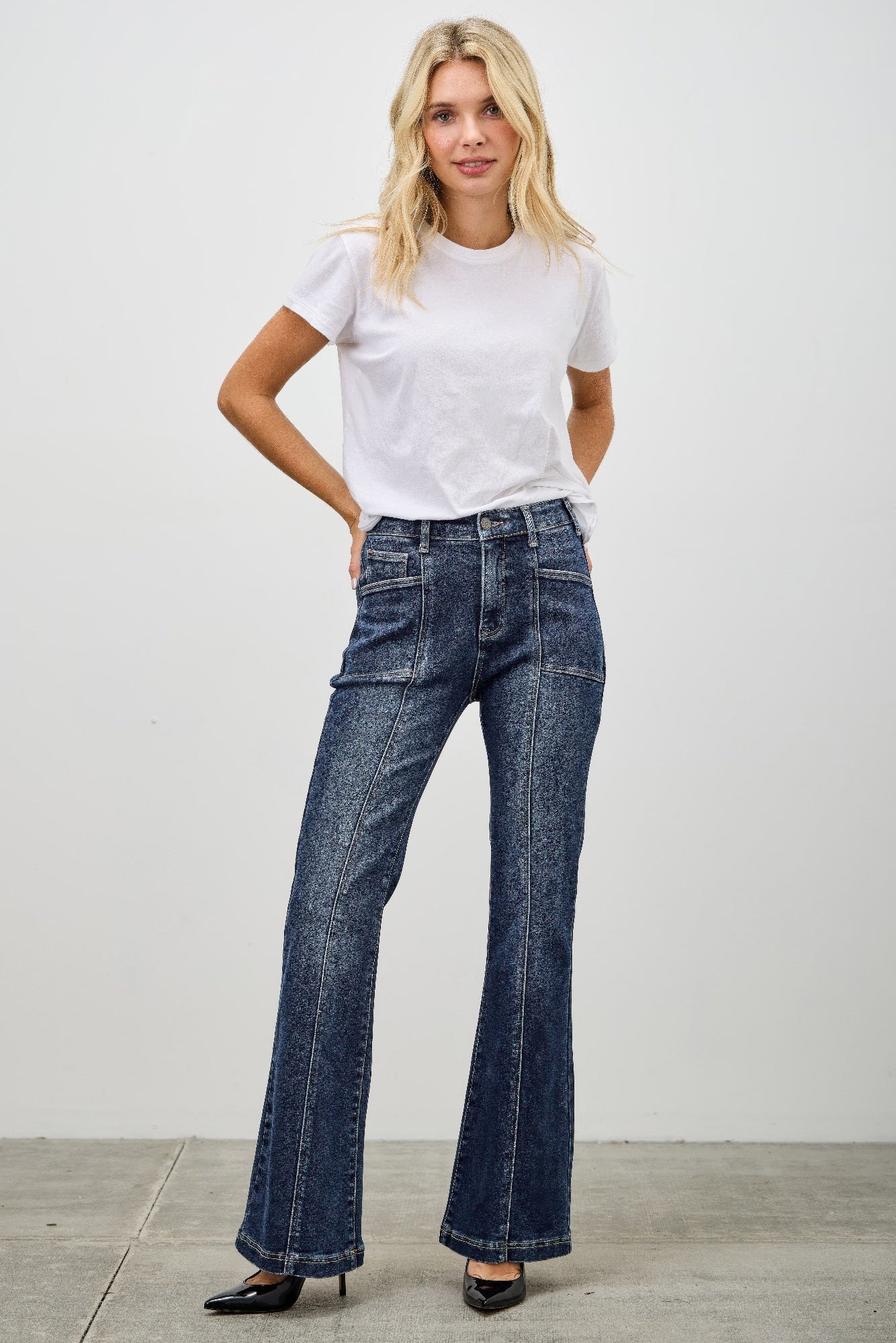 Toshe Women's Fashions high rise boot cut jeans with seam detail, showcasing fit and stylish design.