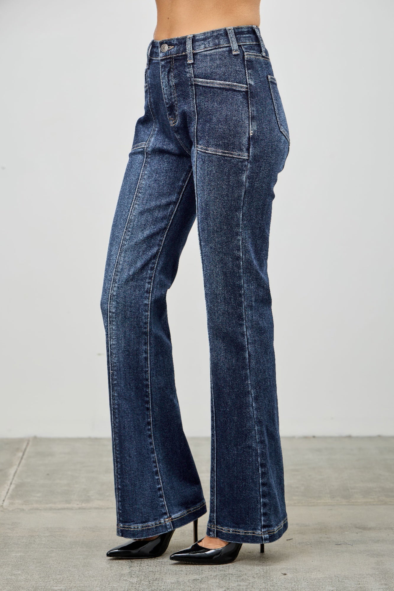 Toshe women's high rise boot cut jeans with seam detail, showcasing the stylish fit and design on a model.