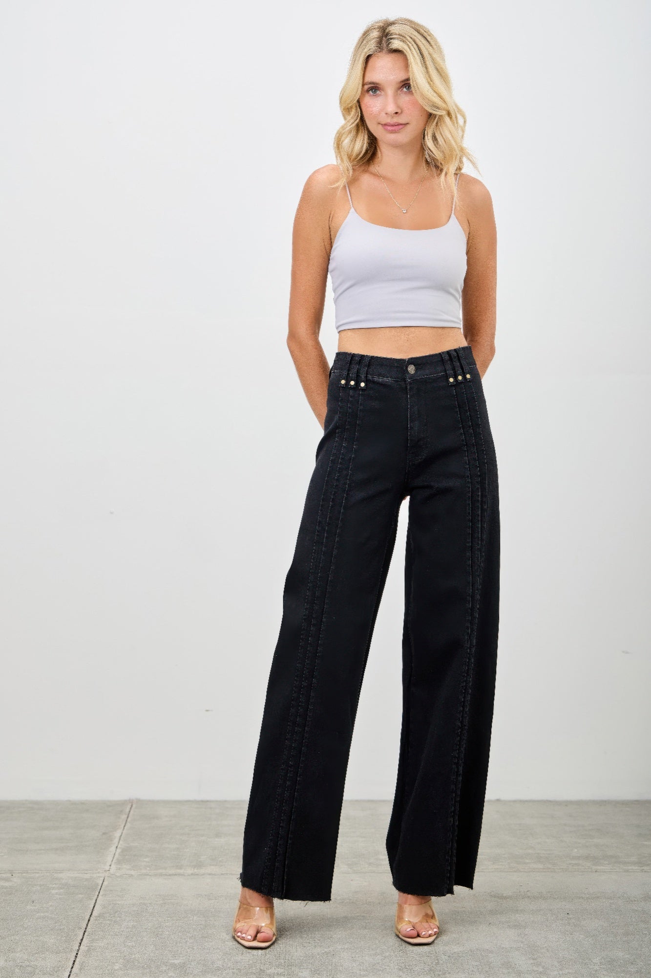 Toshe Women's Fashions high-rise straight jeans with front line details, shown on a model.