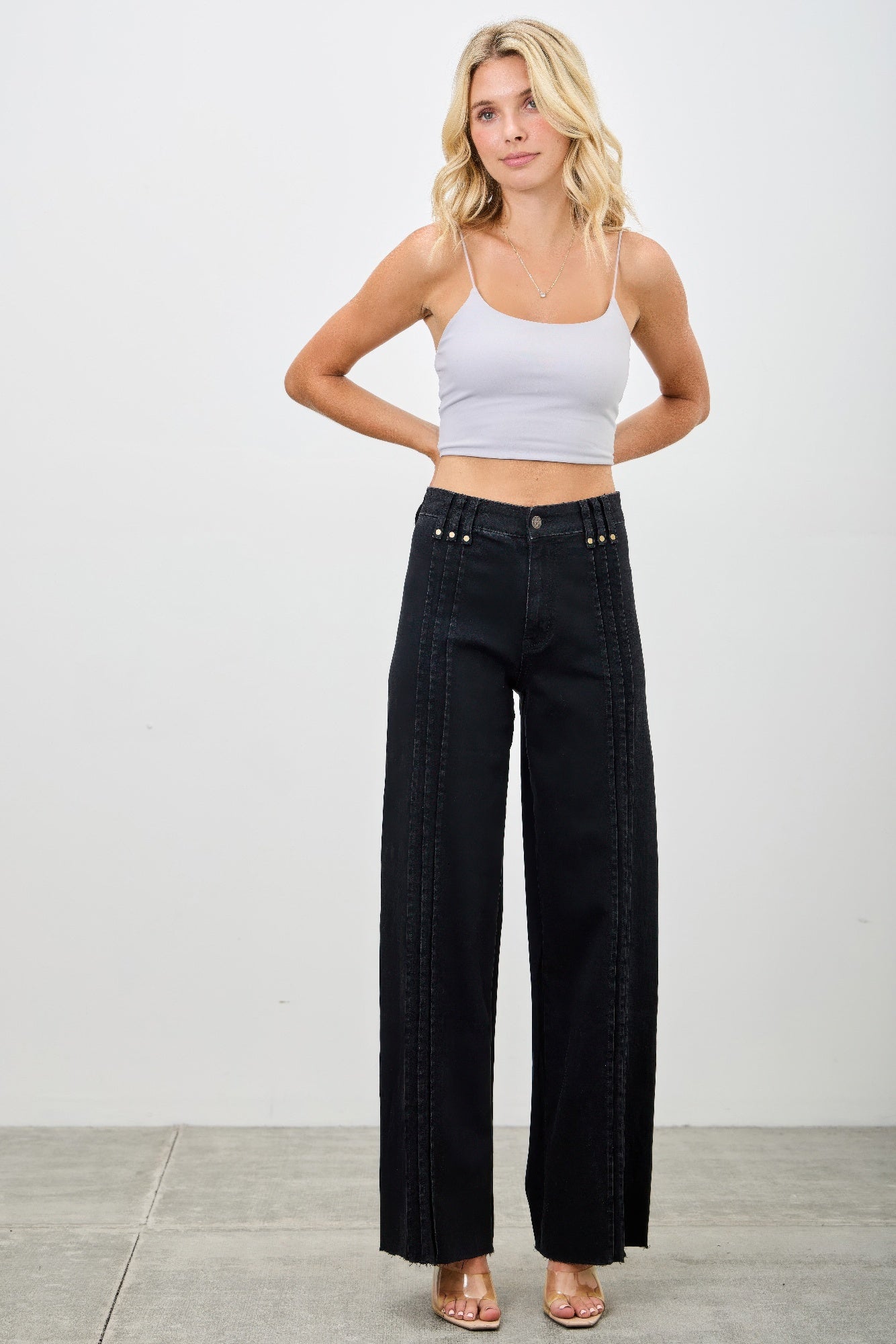 Toshe Women's Fashions high rise straight jeans with front line detailing, shown in a front view on a model.