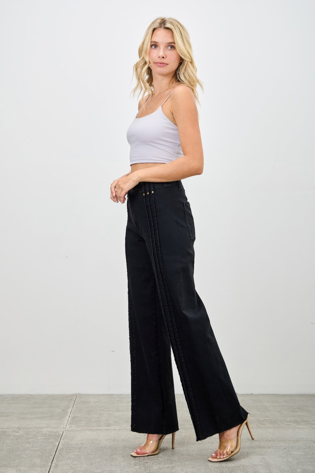 Toshe Women's Fashions high rise straight jeans with front line detailing, showcasing a fitted waist and classic denim style.