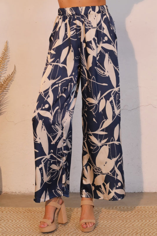 Cream satin pocket pants by Toshe Women's Fashions featuring a relaxed fit and stylish design, shown on a model.