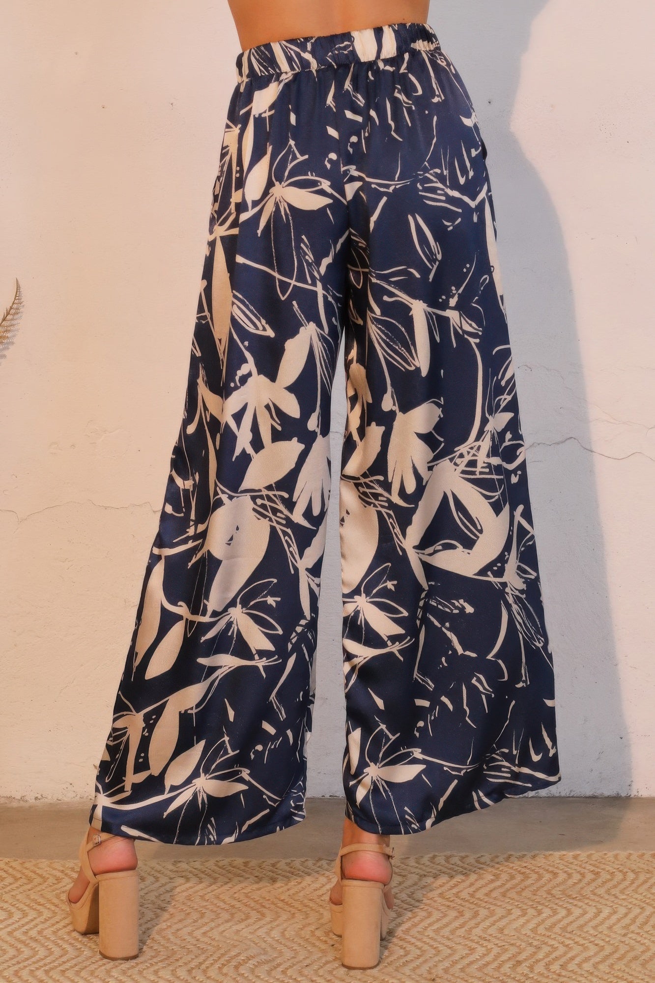 Dreaming Lily satin pocket pants by Toshe Women's Fashions featuring a relaxed fit and side pockets in a silky satin fabric.