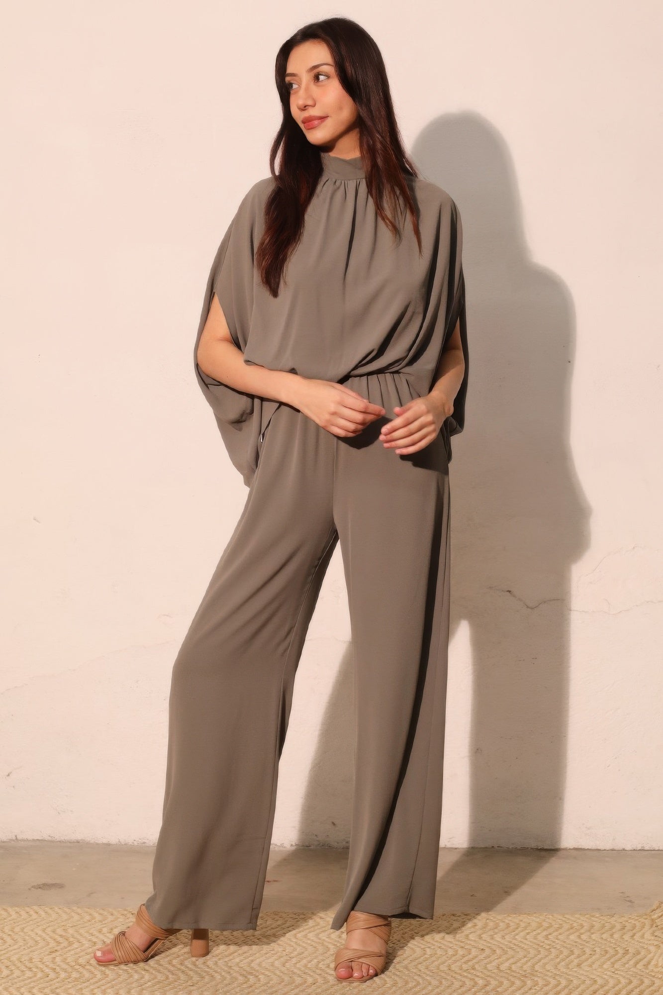 Textured solid mock neck caftan jumpsuit by Toshe Women's Fashions, featuring a relaxed fit and stylish design.