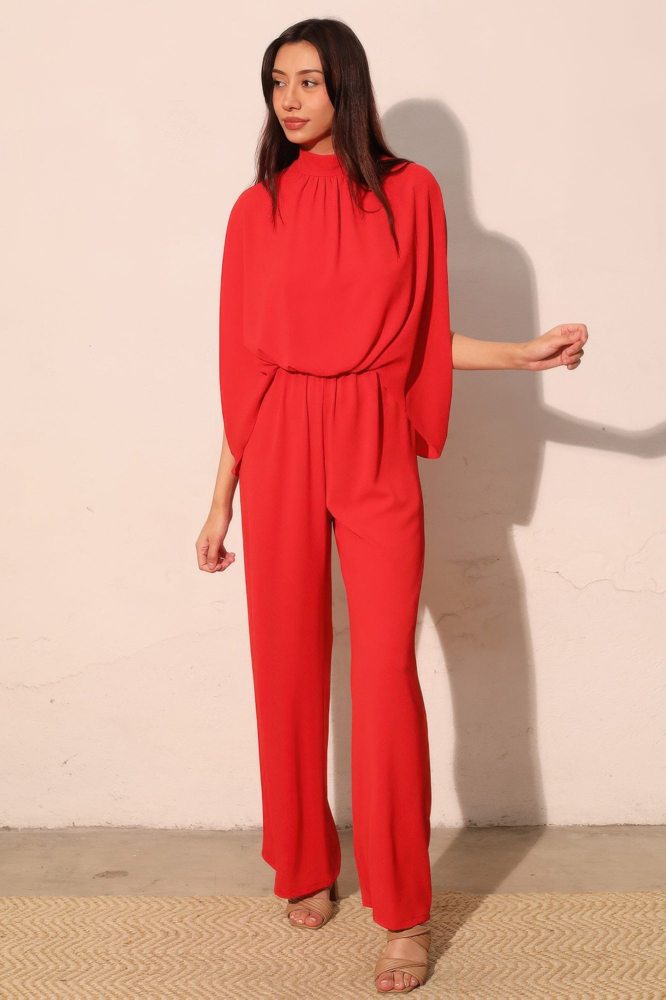 Textured solid mock neck caftan jumpsuit by Toshe Women's Fashions, featuring flowing fabric and relaxed fit.