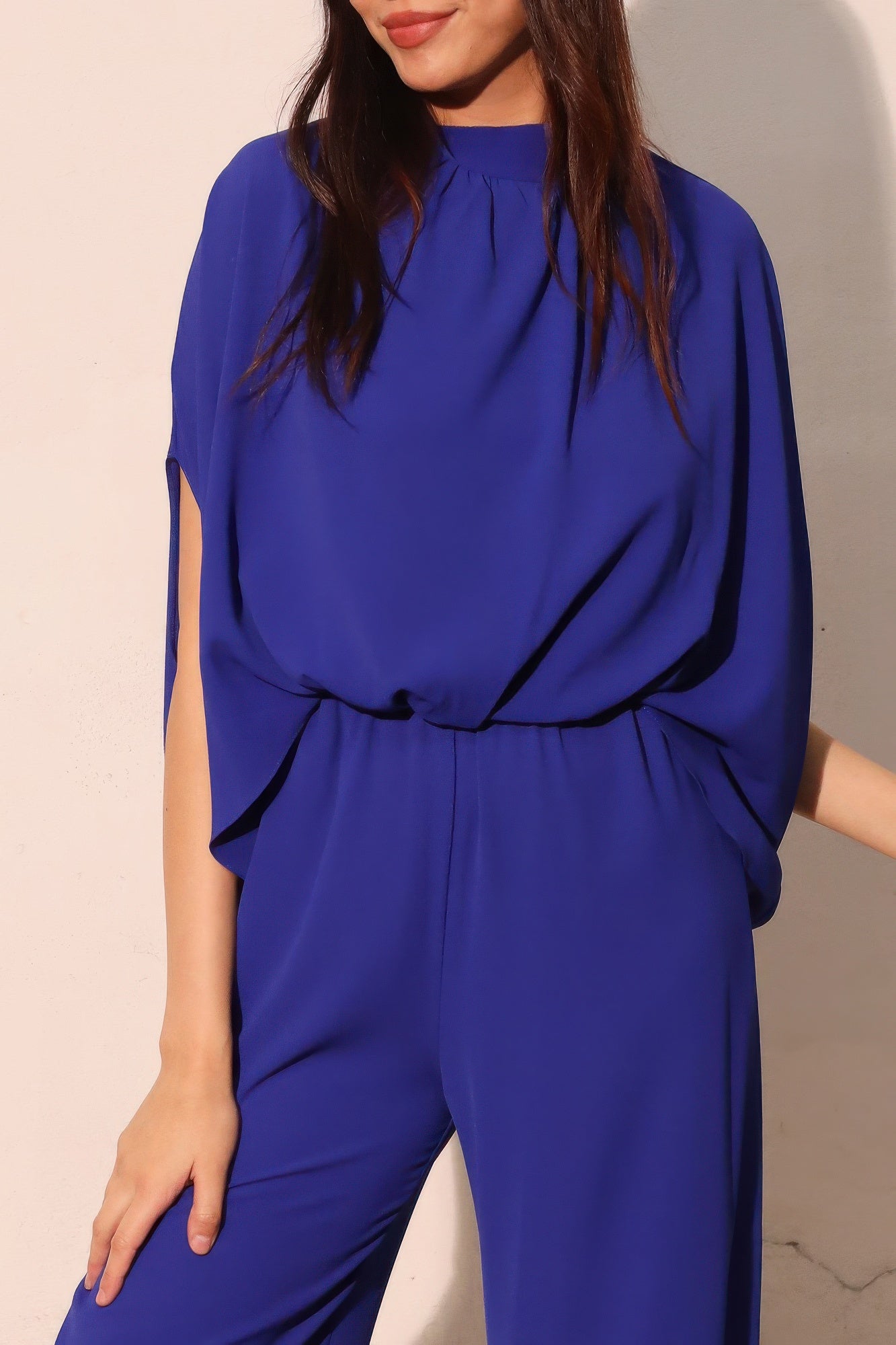 Textured solid mock neck caftan jumpsuit by Toshe Women's Fashions, featuring a relaxed fit and stylish design.