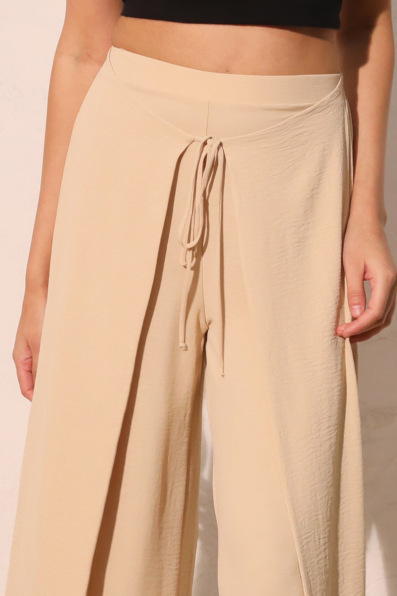 Matte crepe overlap pants in neutral color from Toshe Women's Fashions, featuring a relaxed fit and stylish design.