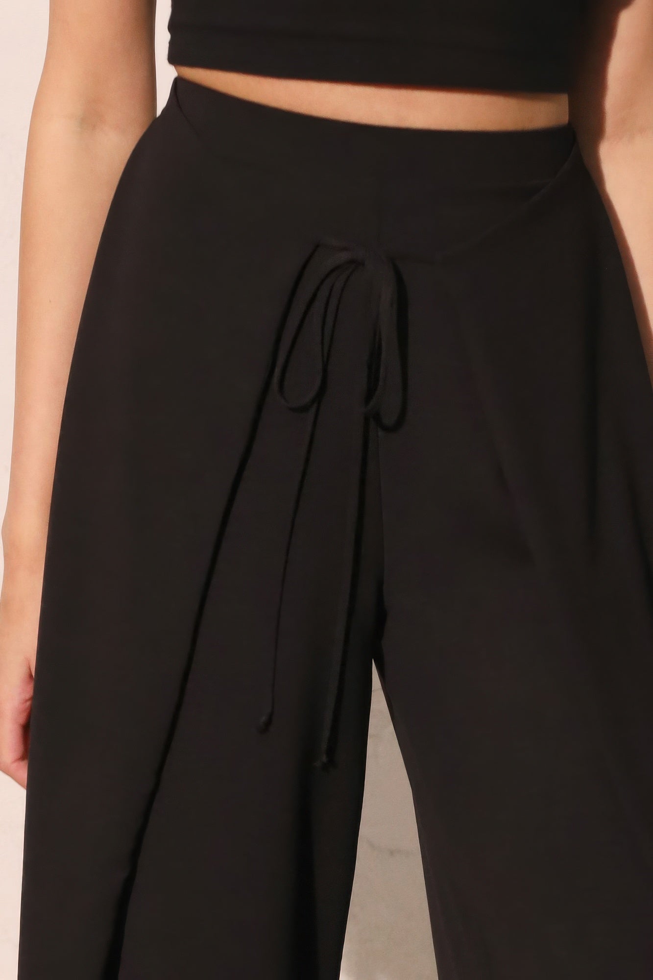 Matte crepe overlap pants in neutral color from Toshe Women's Fashions, featuring a relaxed fit and stylish design.