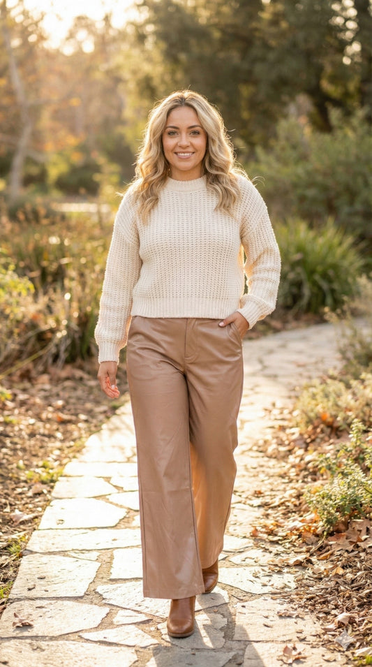 Faux leather wide-leg pants by Toshe Women's Fashions, featuring a high waist and flowing silhouette, shown in black.