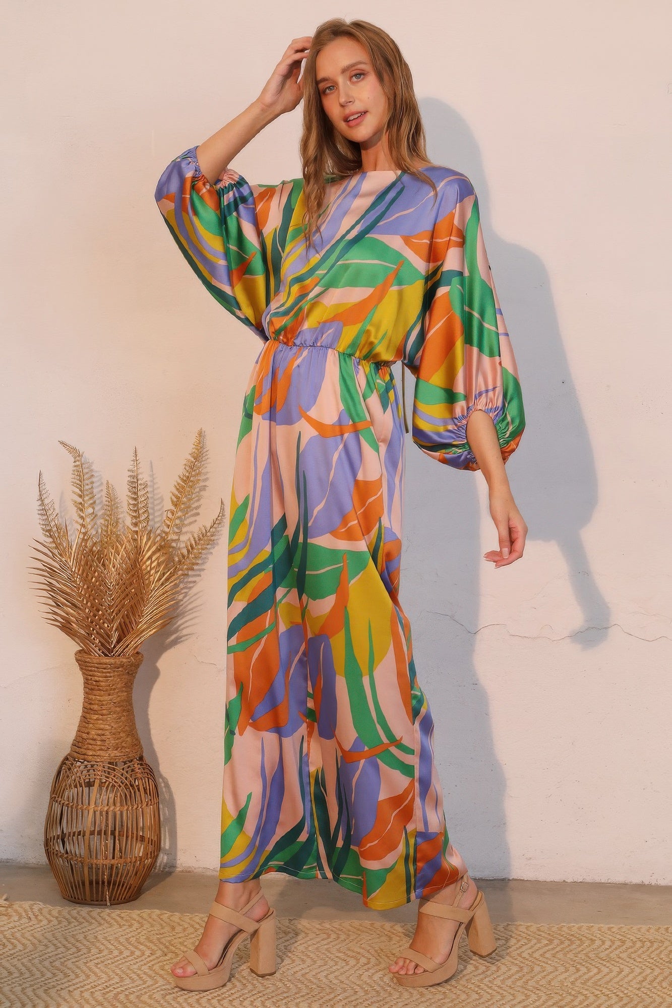 Toshe Women's Fashions Isla Tropical Satin Boat Neck Blouson Jumpsuit, front view showing elegant tropical print and relaxed fit.
