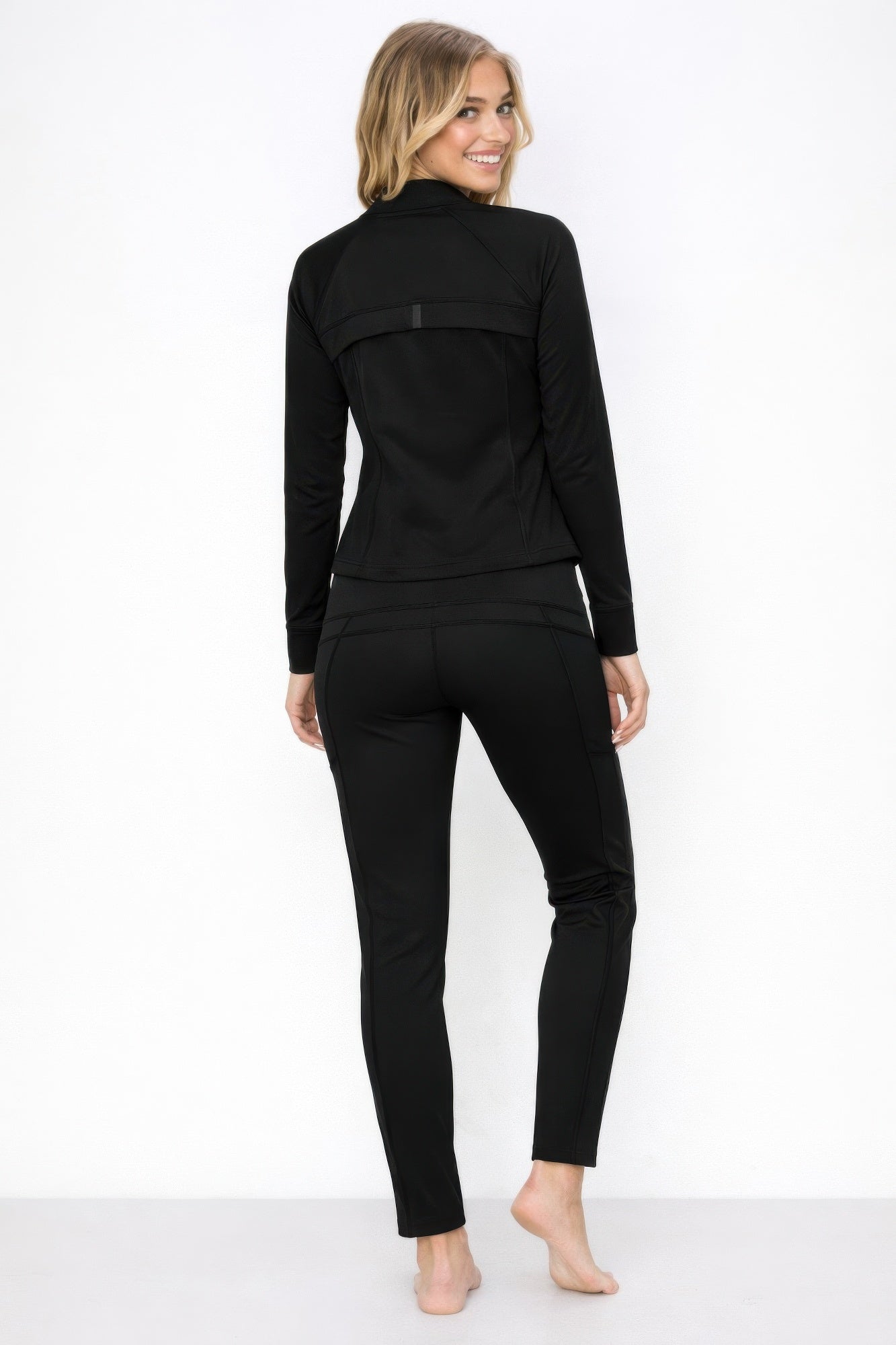 Brown high neck zip-up jacket and pant set by Toshe Women’s Fashions, shown on a model with a casual pose.