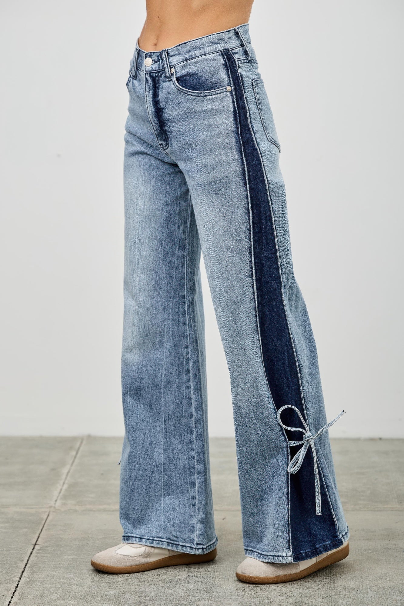 Mid-rise contrast wide-leg pants with side leg tie from Toshe Women's Fashions, featuring a stylish and relaxed fit.