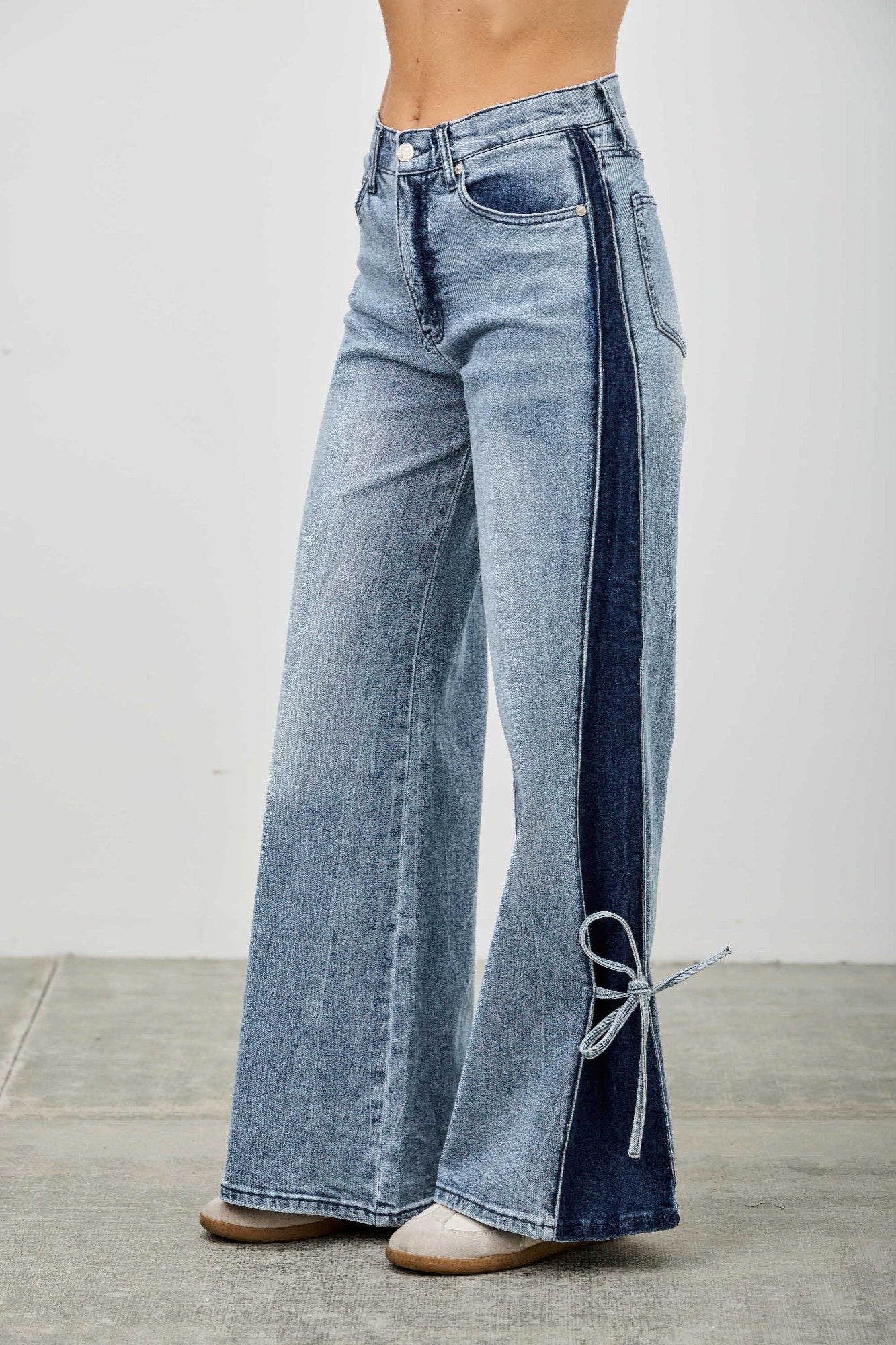 Mid-rise contrast wide-leg pants with side leg tie from Toshe Women's Fashions, shown on a model against a white background.