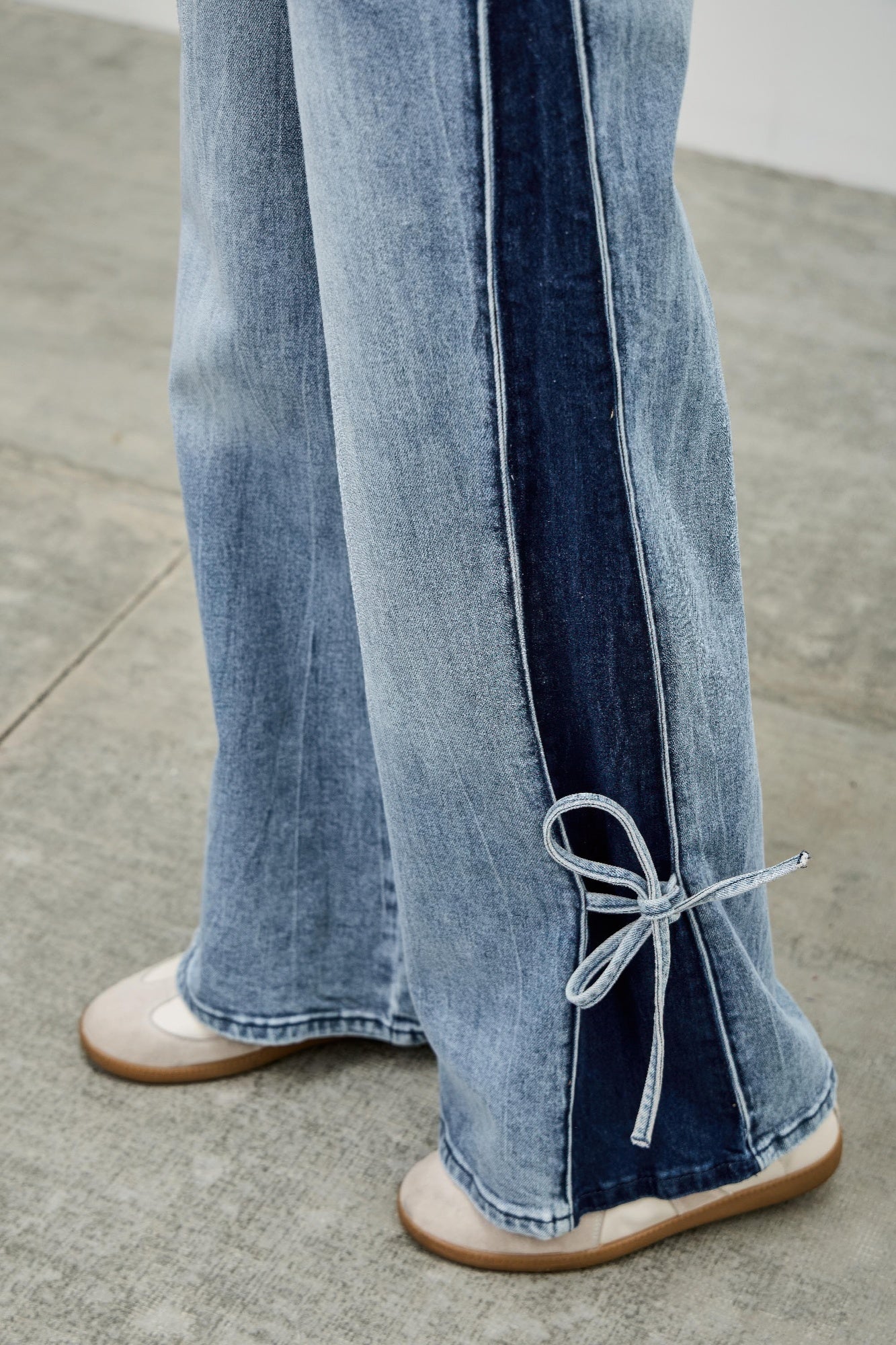 Toshe Women's Fashions mid-rise contrast wide-leg pants with side leg ties, shown in a stylish and comfortable fit.