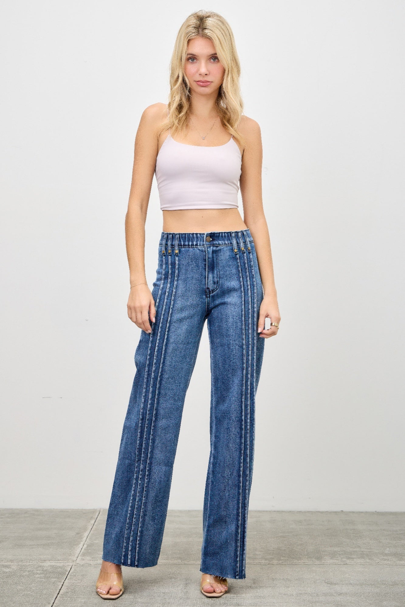 High rise straight jeans with front line detailing from Toshe Women's Fashions, shown on a model.