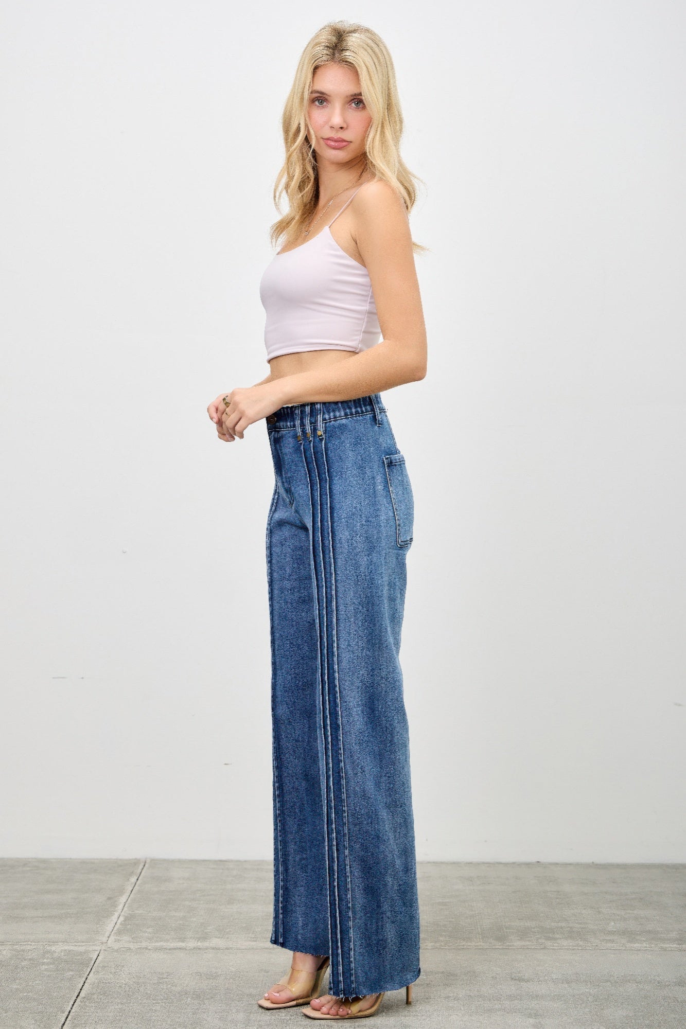Toshe Women's Fashions high-rise straight jeans with front line details, shown in dark wash denim with a clean, fitted look.