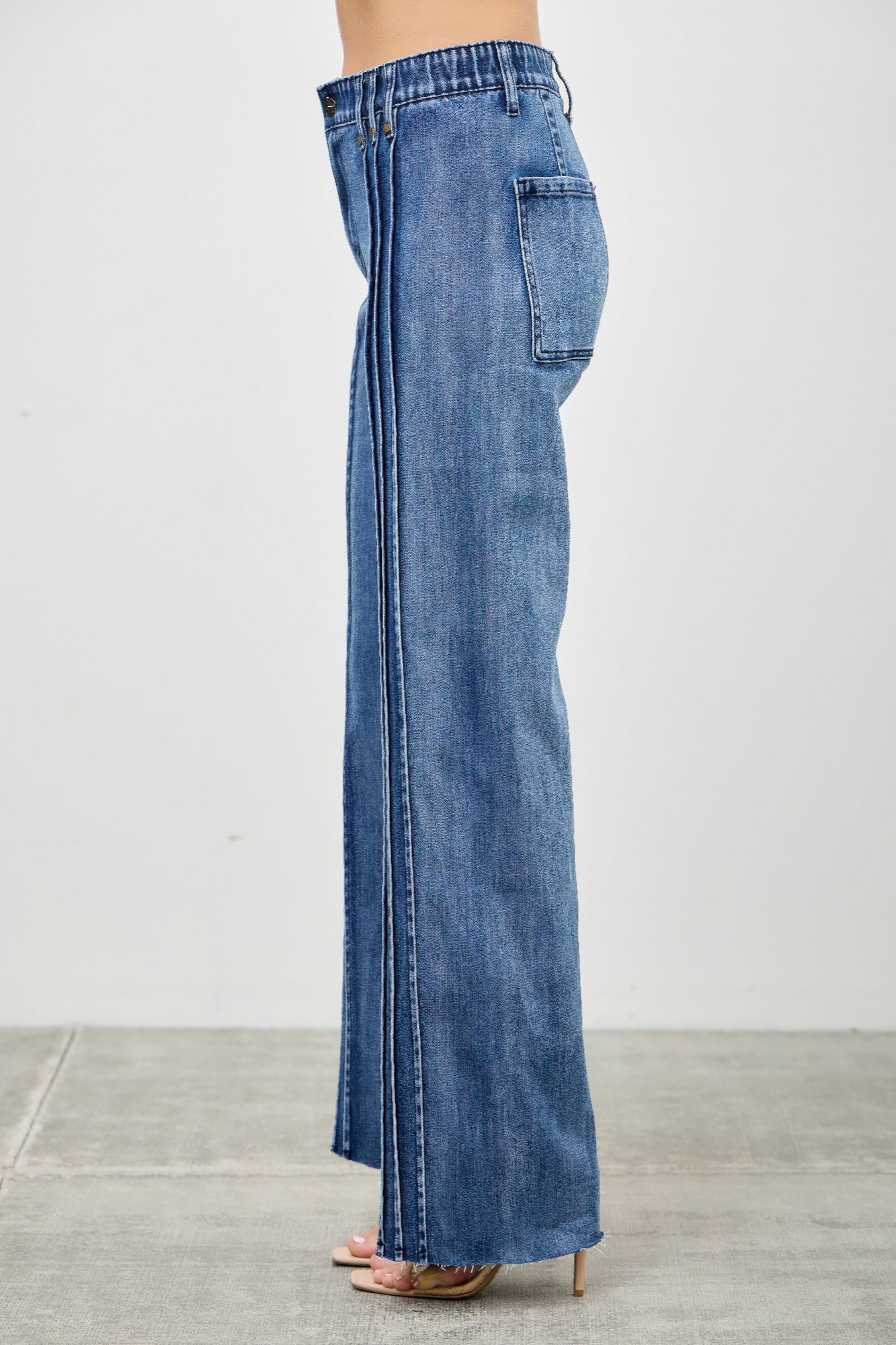 Toshe Women's Fashions high rise straight jeans with front line detailing, shown on a model.