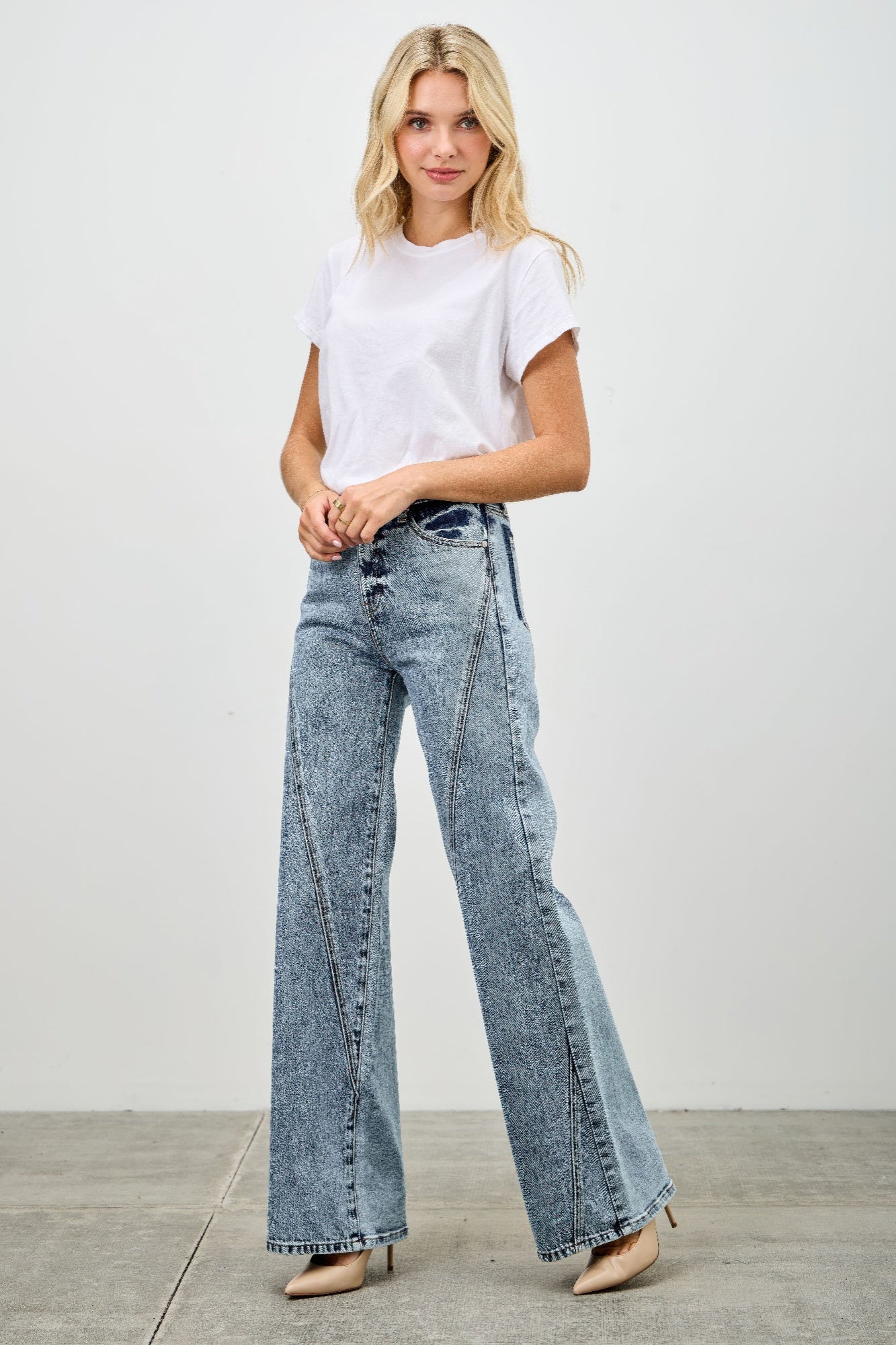 Light wash high rise relaxed straight jeans with seam detail from Toshe Women's Fashions, shown on a model.