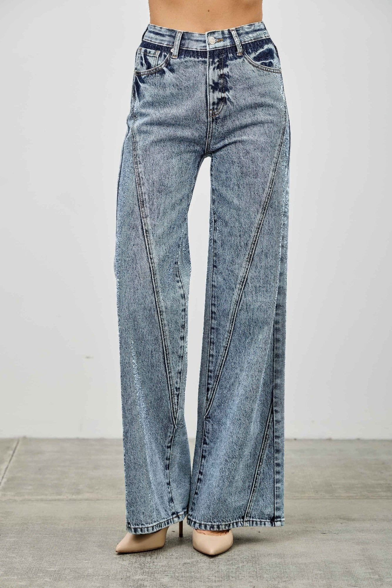 Light blue high rise relaxed straight jeans with seam detail from Toshe Women's Fashions, shown on a model.