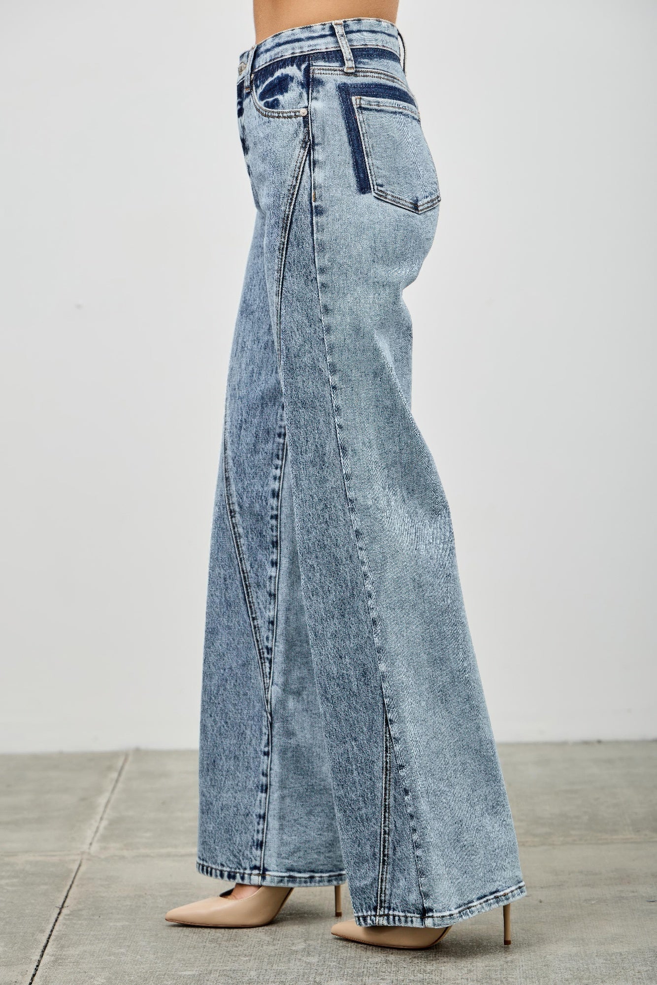 High-rise relaxed straight jeans with seam detail from Toshe Women's Fashions, shown on a model. Denim fabric and stitching visible.