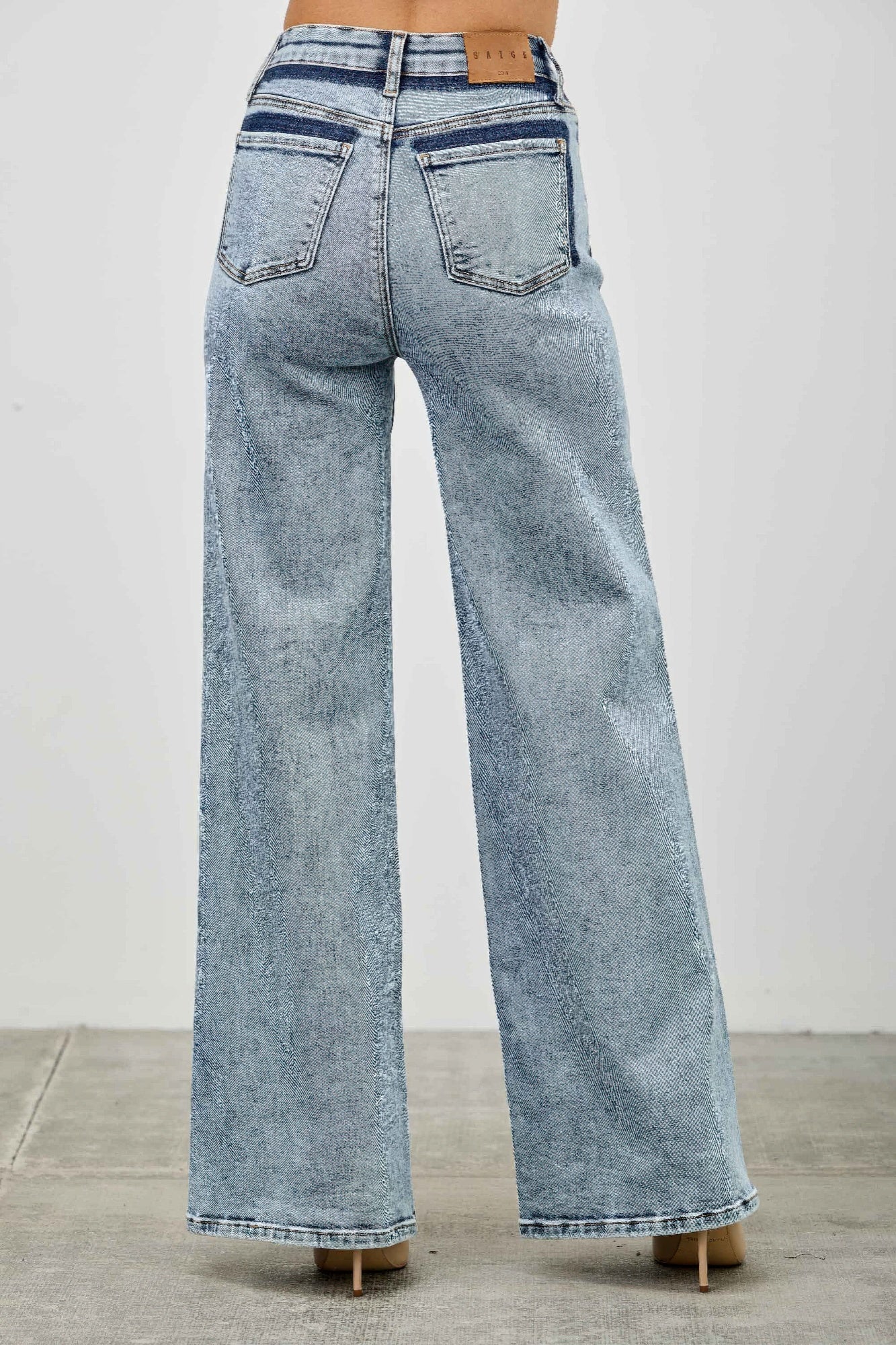 Toshe Women's Fashions high rise relaxed straight jeans with seam detail, showcasing a casual fit and stylish stitching.