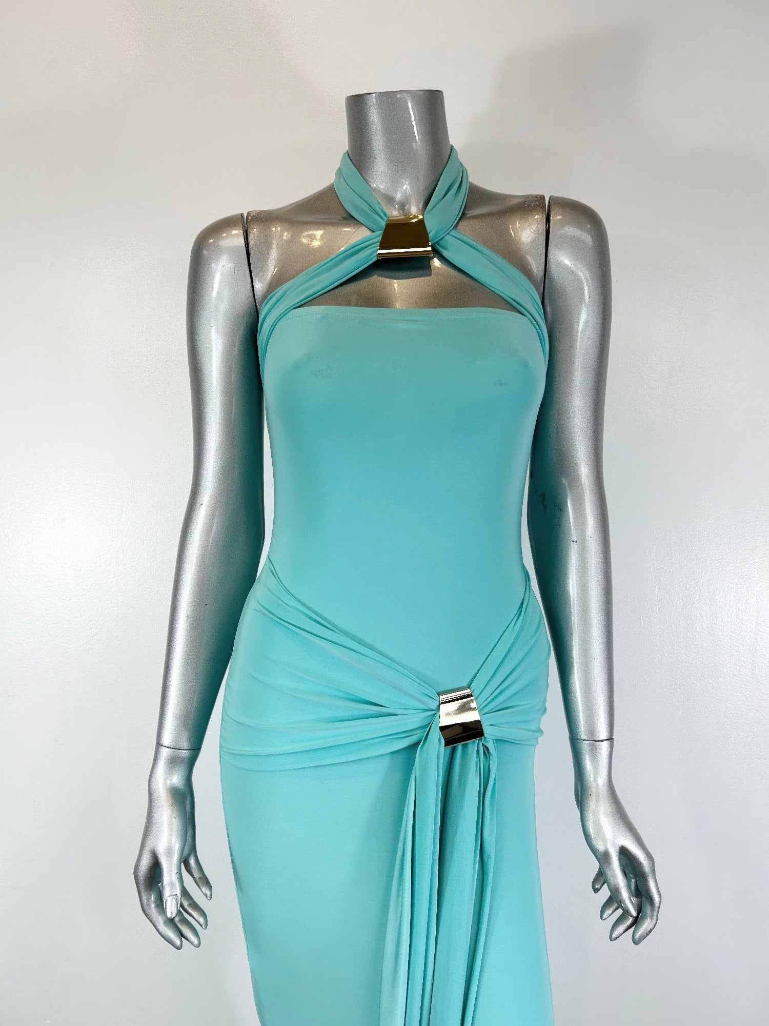 Halter-style bodycon midi dress by Toshe Women's Fashions, shown in sleek black fabric with fitted silhouette and modern design.