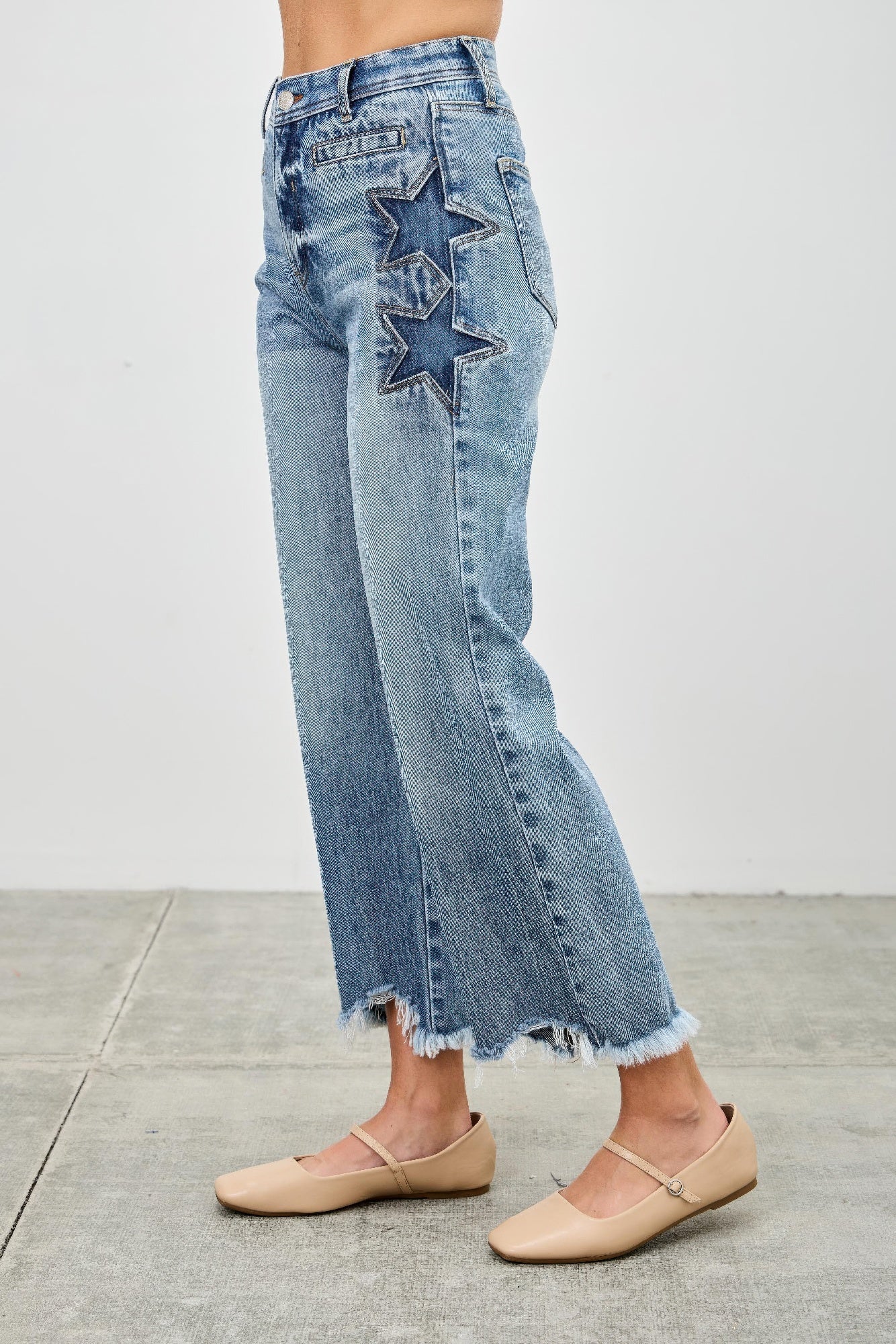 High-rise wide-leg crop jeans with star embroidery from Toshe Women's Fashions, shown on a model.