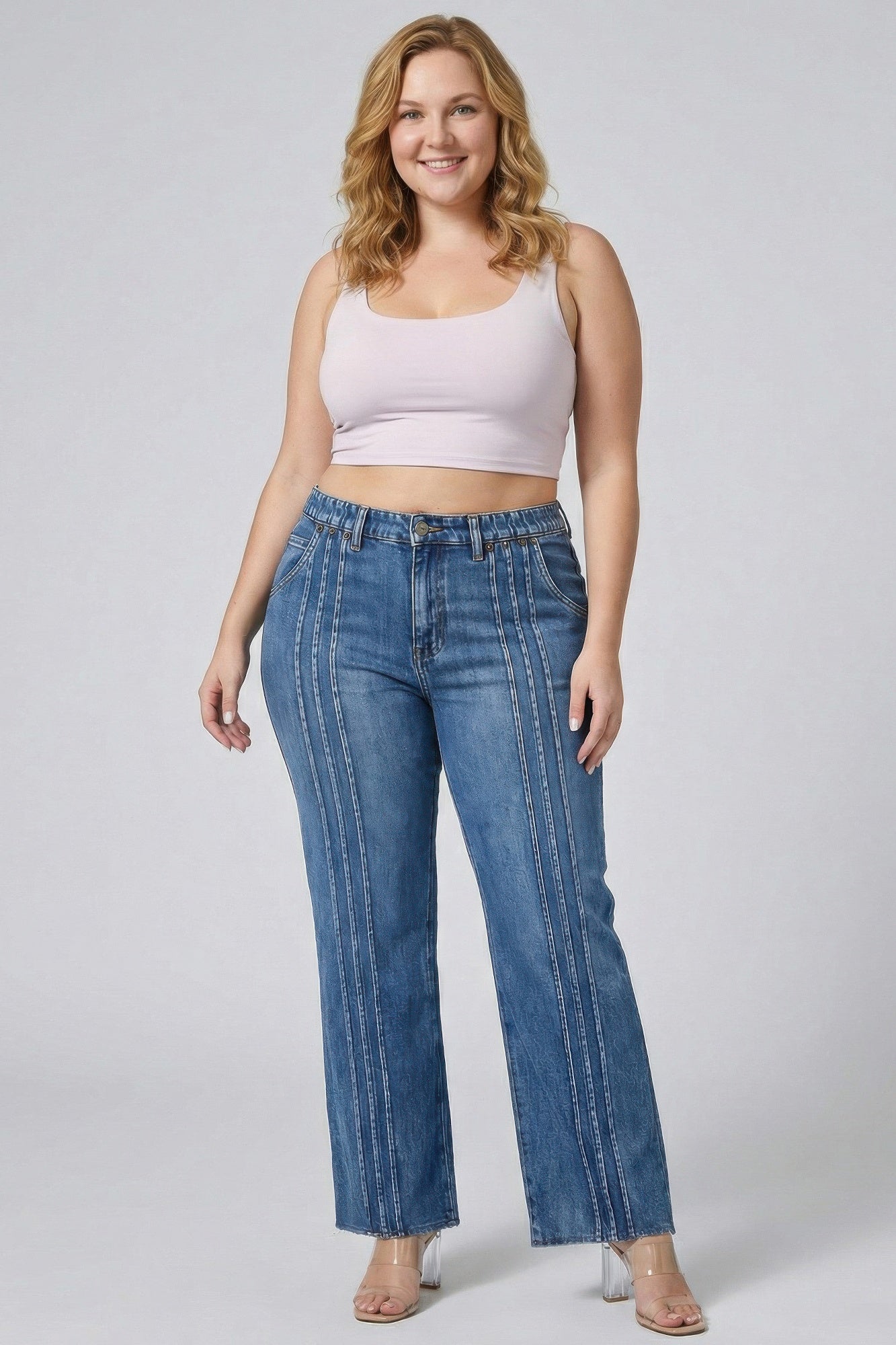 Toshe Women's Fashions high rise straight jeans with front line detailing, shown on a model.