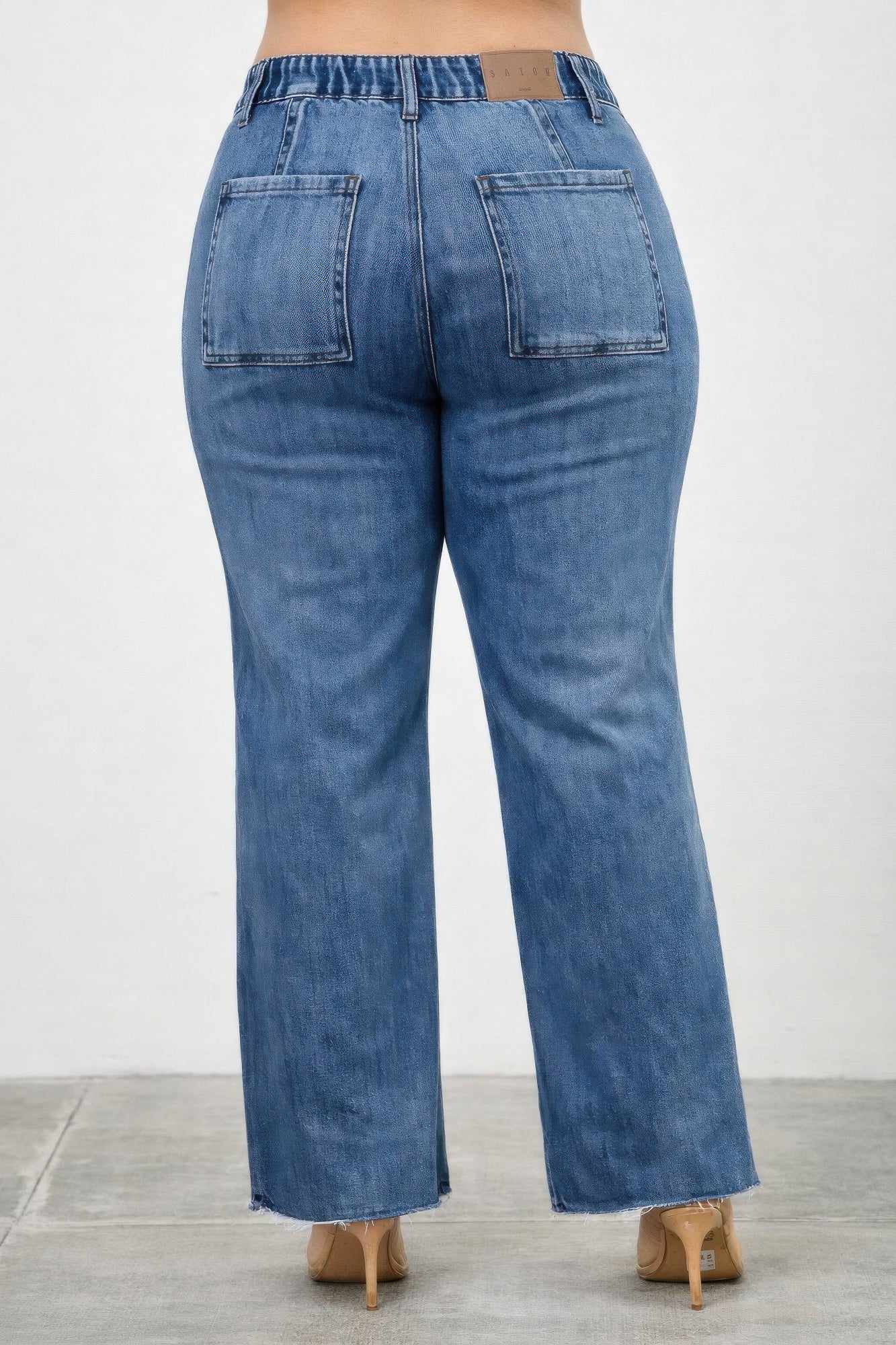 High rise straight jeans with front line details from Toshe Women's Fashions, showing the fit and stylish design.
