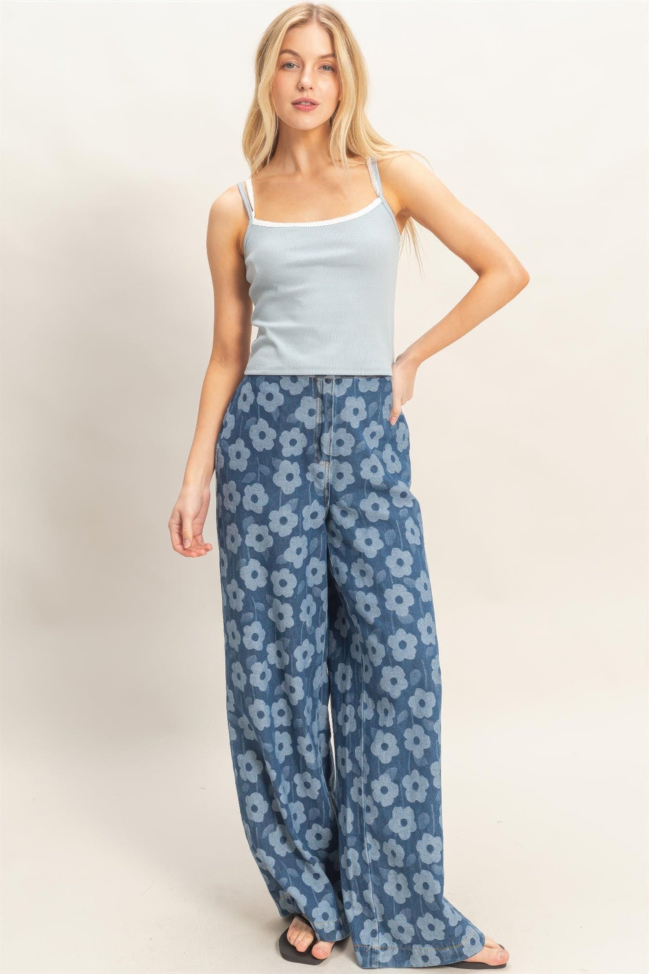 Floral wide-leg pants by Toshe Women's Fashions featuring a flowy design and vibrant floral pattern on light fabric.