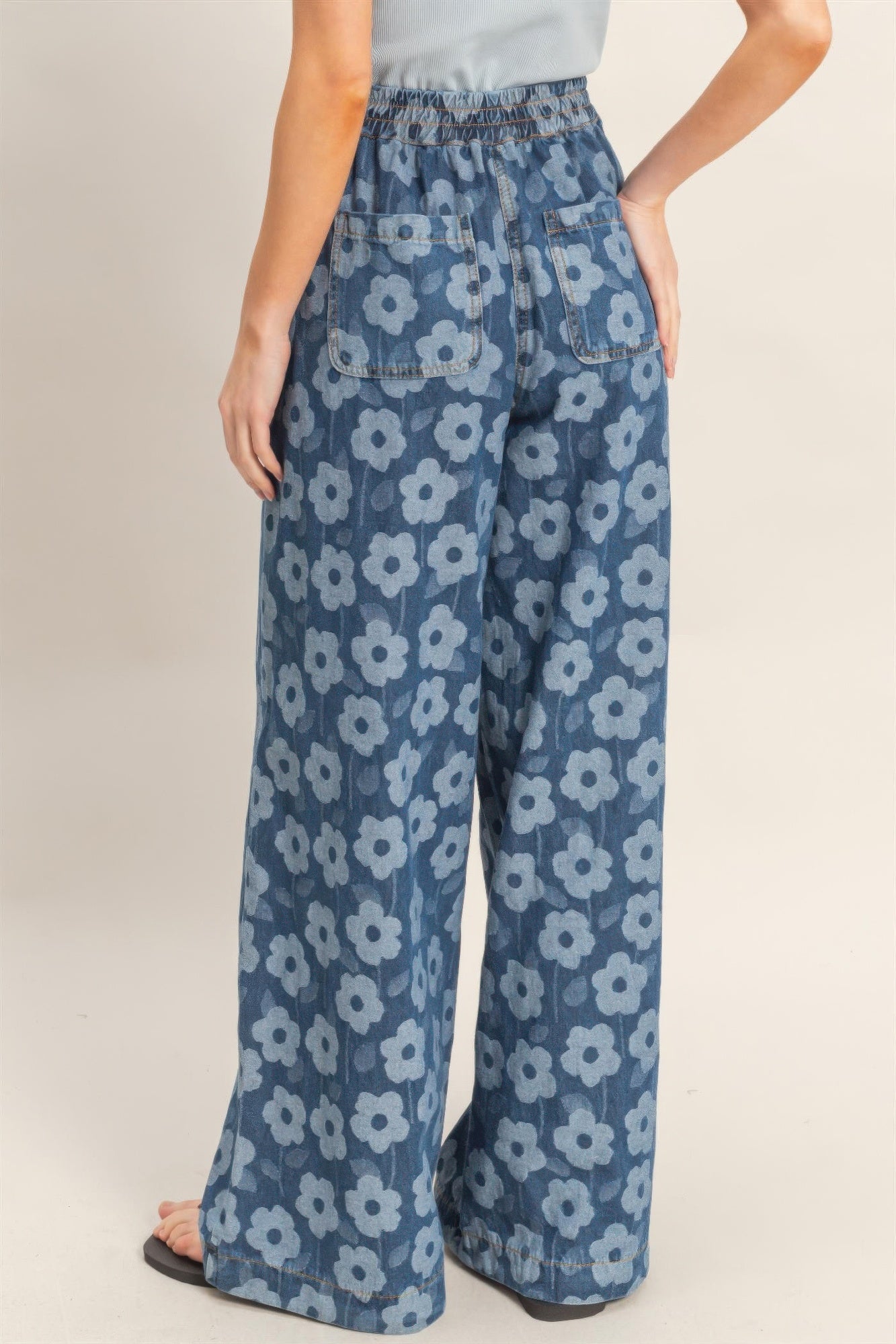Floral wide-leg pants from Toshe Women's Fashions with a relaxed fit and vibrant floral pattern.