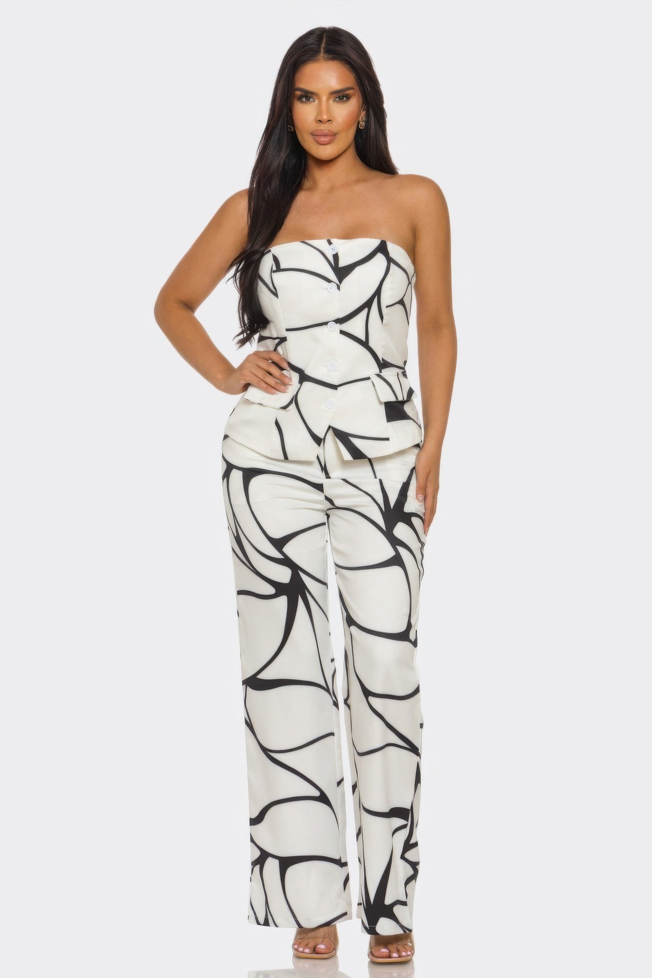 Abstract Motion Set by Toshe Women's Fashions featuring a colorful, flowing abstract print on a stylish outfit.