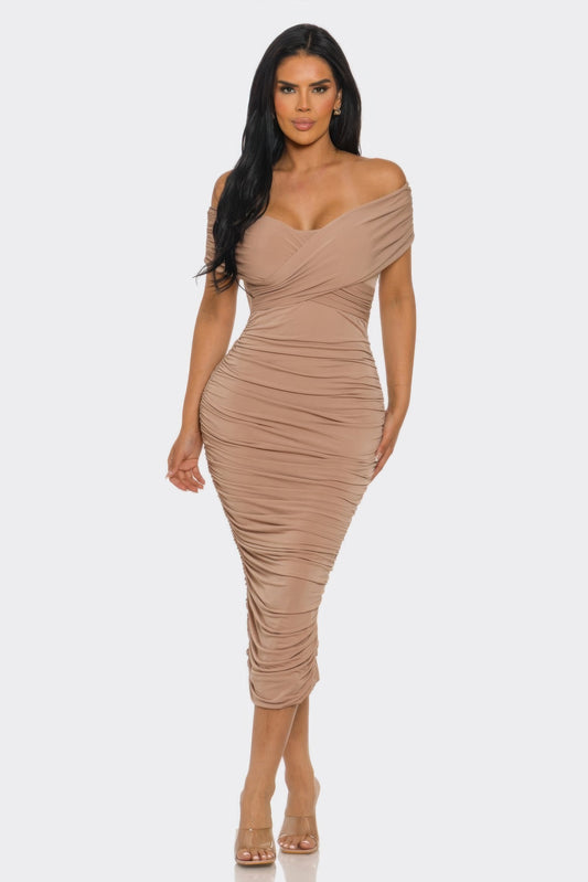 Elysian Drap by Toshe Women's Fashions, showcasing a stylish women's dress with elegant draping and vibrant fabric.